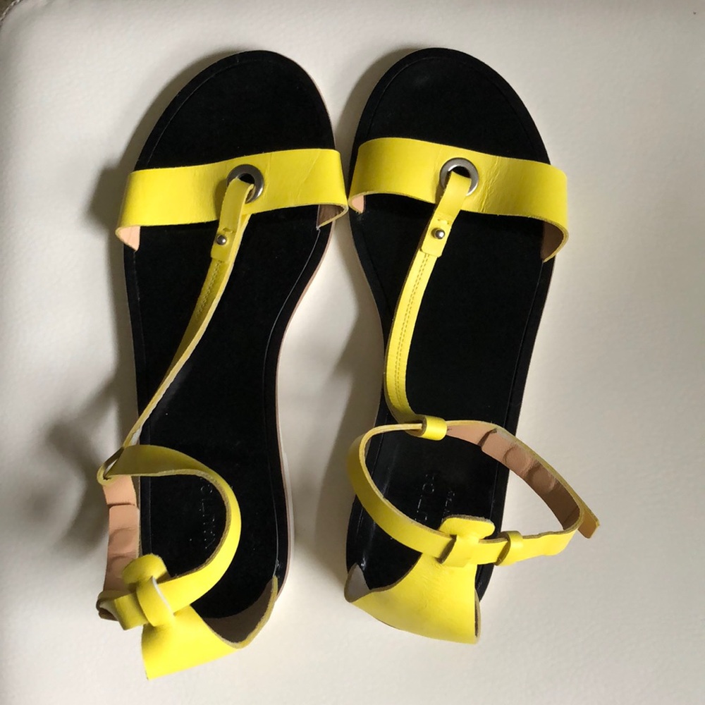 Women’s yellow and black sandal.